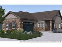Charming home featuring a stone and siding exterior, well-maintained landscaping, and a two-car garage at 844 W 128Th Pl, Westminster, CO 80234