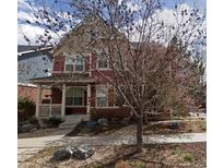 Charming two-story home with a cozy front porch and inviting curb appeal at 2502 Alton St, Denver, CO 80238