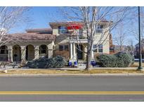 Two story home with covered porch, balcony and meticulously maintained landscaping at 2962 Akron Ct, Denver, CO 80238