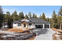 A charming two-story home with a two-car garage and mountain views at 8006 S Settlers Dr, Morrison, CO 80465