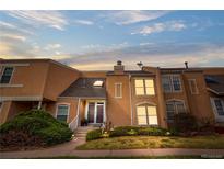 Inviting townhome with a well-manicured lawn and tasteful landscaping, offering a warm and welcoming curb appeal at 2925 S Vaughn Way, Aurora, CO 80014