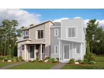 Modern townhome with brick and siding exterior, front porch, and well-manicured landscaping at 24118 E Warm Springs Ave, Aurora, CO 80019