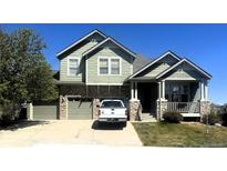 Charming two-story home featuring a two-car garage and inviting front porch at 3935 Broadview Pl, Castle Rock, CO 80109