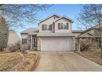 Charming two-story home with a large two-car garage and a well-maintained front yard at 5130 S Wenatchee St, Aurora, CO 80015