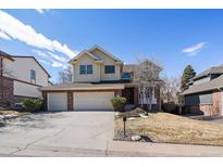 Charming two-story home with a three-car garage and a well-maintained front yard at 8181 S Saint Paul Way, Centennial, CO 80122