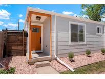 Charming home entrance with an orange door, stylish accents, and a well-maintained exterior at 1023 Hooker St, Denver, CO 80204