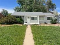 Charming single-story home with a well-maintained lawn and inviting entrance at 2815 S Dexter Way, Denver, CO 80222