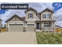 Charming two-story home featuring a three-car garage and a welcoming front porch at 3508 Silverado Cir, Frederick, CO 80516