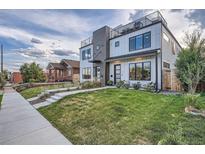 Modern two-story home featuring a rooftop terrace and landscaped front yard at 3911 Mariposa St, Denver, CO 80211