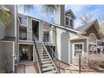 Inviting condo exterior features a well-maintained facade, landscaped grounds, and a welcoming staircase leading to the entrance at 6776 S Ivy St # B5, Centennial, CO 80112