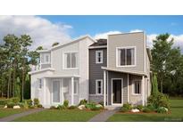 Attractive new two-story townhome featuring a partial brick facade and modern architectural details at 24108 E Warm Springs Ave, Aurora, CO 80019