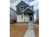 Charming two-story home with gray siding and a welcoming front porch and landscaped yard at 23782 E 33Rd Pl, Aurora, CO 80019