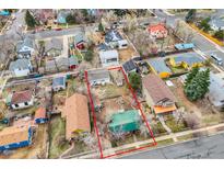 Aerial view of home with a large lot, mature trees, and colorful neighboring houses at 930 Parkview St, Louisville, CO 80027