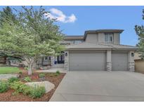 Charming two-story home boasts a three-car garage, well-maintained landscaping, and mature shade tree in the front yard at 877 Eldorado Dr, Superior, CO 80027