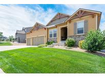 Two-story house with a landscaped lawn and attached garage at 3995 Manorbrier Cir, Castle Rock, CO 80104