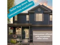 Charming two-story home with a covered front porch and well-maintained landscaping offers seller concessions at 5249 Mt Arapaho Cir, Frederick, CO 80504