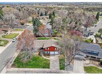 Charming two-story home boasting a mature, lush landscape and a two car garage at 8320 W Harvard Dr, Lakewood, CO 80227