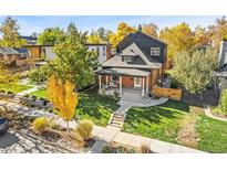 Attractive brick home with a landscaped yard and walkway at 3267 Stuart St, Denver, CO 80212