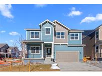 Charming two-story home with a welcoming front porch and attached two-car garage at 5625 W 141St Ln, Broomfield, CO 80020