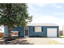 Inviting single-story home features a well-manicured lawn, new exterior paint, and attached one-car garage at 10024 Holland Ct, Broomfield, CO 80021
