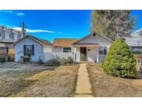 Charming single-story home with a well-defined pathway and a neatly maintained front yard at 2171 S Cherokee St, Denver, CO 80223