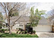 Charming home with a well-manicured lawn, mature trees, and a driveway leading to a two-car garage at 4530 S Verbena St # 316, Denver, CO 80237