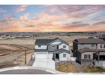 Beautiful exterior view of a modern two-story home featuring well-maintained landscaping and neighborhood views at 17851 Herrera Dr, Parker, CO 80134