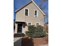 Charming two-story home with a well-maintained front yard and inviting entrance at 2469 Ames St, Edgewater, CO 80214
