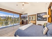 Spacious main bedroom with mountain views, ensuite bathroom, and television for cozy relaxation at 94 Lake View Dr, Breckenridge, CO 80424