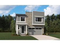 Modern two-story home featuring a stone facade, gray siding, and an attached two-car garage at 11217 Mount Emma Dr, Englewood, CO 80112