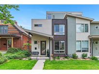 Modern townhome with a well-manicured lawn and unique architectural details on a sunny day at 3885 Vrain St, Denver, CO 80212