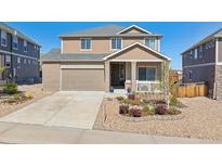 Charming two-story home featuring a brick and siding exterior, landscaped front yard, and an attached two-car garage at 3727 Starry Night Loop, Castle Rock, CO 80109