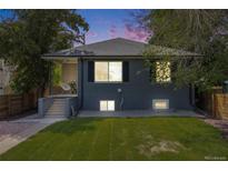Charming home with a well-maintained lawn and inviting front porch at 1765 Xenia St, Denver, CO 80220
