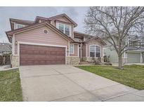 Charming two-story home with a two-car garage and well-maintained lawn at 8426 W 97Th Pl, Broomfield, CO 80021