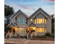 Charming duplex with gabled roofs, bay windows, and inviting front porches at 1131 Elizabeth St, Denver, CO 80206