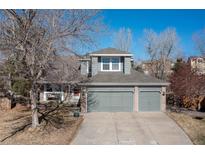 Charming two-story home with a three car garage and well maintained landscaping in a suburban neighborhood at 10903 Parker Vista Way, Parker, CO 80138