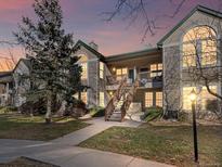 Attractive exterior of a two-story townhome with a staircase and landscaping at 4005 S Dillon Way # 102, Aurora, CO 80014