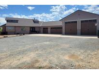 Ranch style home with multiple garage doors and circular driveway on large lot at 3191 W 151St Ct, Broomfield, CO 80023