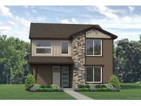 Two story home with brown siding, stone accents, and a teal door at 2315 Peregrine Dr, Brighton, CO 80601