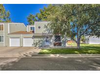 Inviting two-story home with a charming exterior, beautiful lawn, and an attached garage at 16320 E Radcliff Pl # A, Aurora, CO 80015
