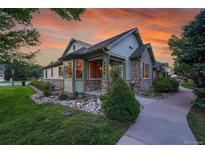 Attractive ranch home with stone accents and landscaped front yard at 5930 S Yank Way, Littleton, CO 80127