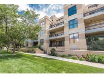 Inviting condo complex featuring well-manicured landscaping, secure entry, and private balconies in a desirable location at 180 N Cook St # 509, Denver, CO 80206