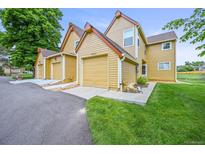 Inviting townhouse with attached garage and well-maintained lawn at 10349 W Fair Ave # A, Littleton, CO 80127