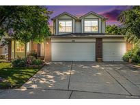 Charming two-story home featuring a three car garage and well-maintained landscaping at 1010 Home Farm Cir, Denver, CO 80234