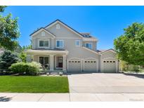 Two-story house with a three-car garage and landscaped lawn at 4686 Longs Ct, Broomfield, CO 80023