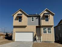 Charming two-story home with a two-car garage and modern architectural details at 16947 W 92Nd Dr, Arvada, CO 80007