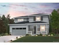 Charming two-story home with a covered porch, attached garage, and beautifully landscaped front yard at 3464 N Irvington St, Aurora, CO 80019