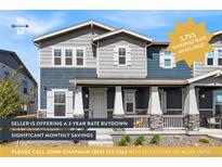 Charming two-story home with gray and blue siding, front porch, and 3.75% interest rate available at 21413 E 59Th Pl, Aurora, CO 80019