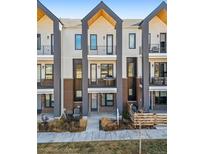 Modern three-story townhome with brick and siding exterior at 3550 Uinta St # 7, Denver, CO 80238