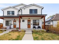 Charming exterior of a modern two-story home with a covered porch and well-maintained lawn at 2571 S Cherokee St, Denver, CO 80223